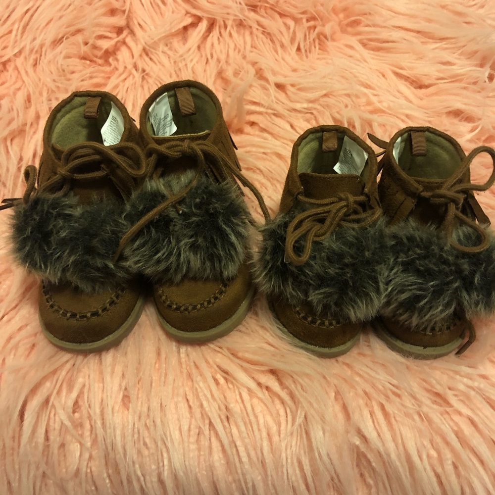 Brown lace up booties with pom poms